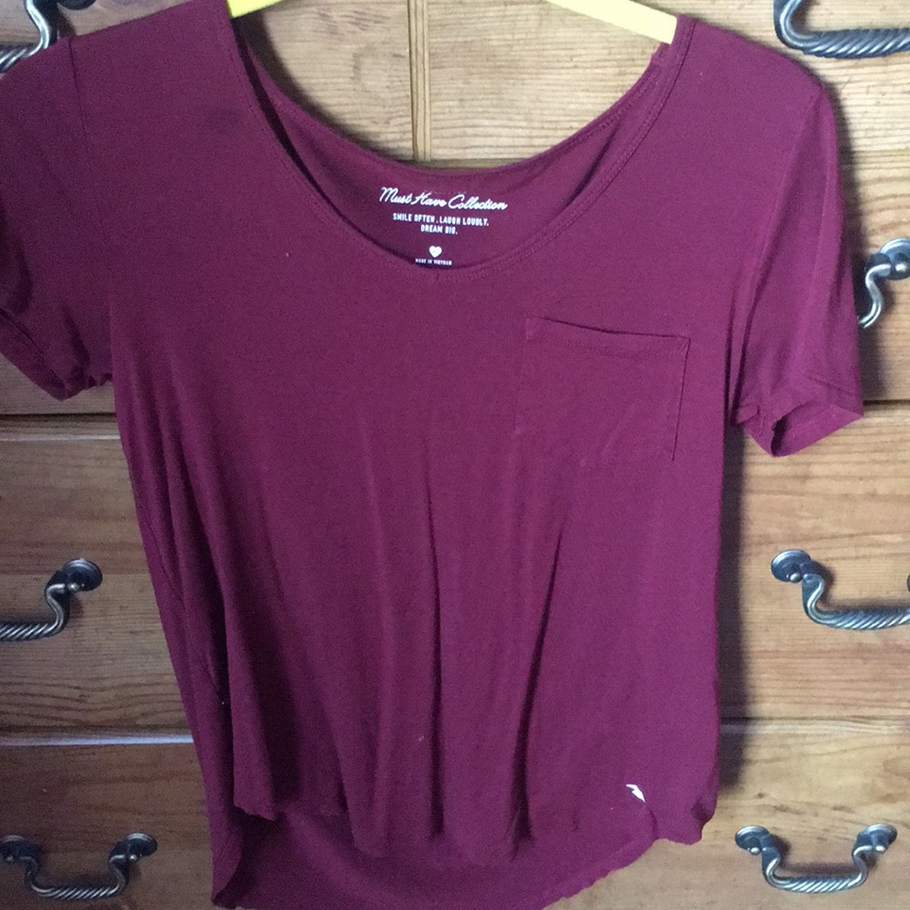 Size small wine red colored shirt!